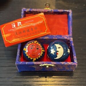 Lotus Pond Brand metal enamel hand exercise balls. Woven fabric box. Like new.